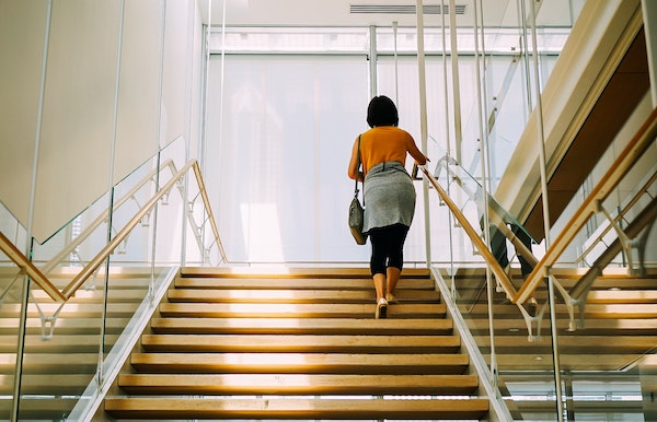 Take the stairs instead of using the elevator - it's one of the tricks that will help you to avoid problems caused by prolonged sitting